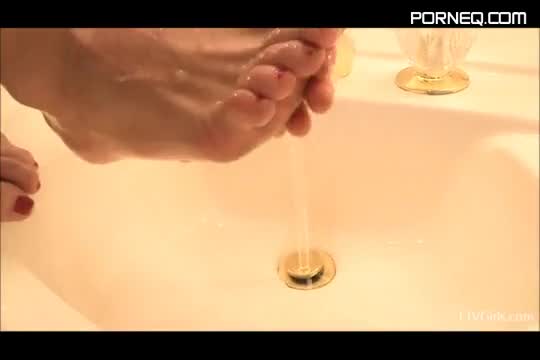 Chloe washes her feet and sucks her toes in the bathroom