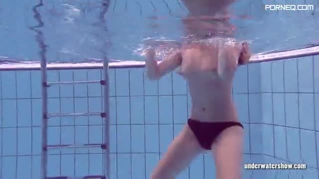 Slim Russian girl Lucy Gurchenko swims naked in underwater show