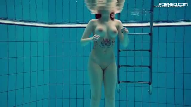 Dashka a sexy gal in lingerie shows her hot tits swimming underwater