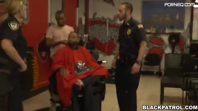 Two white female cops fuck a black suspect in a barber shop